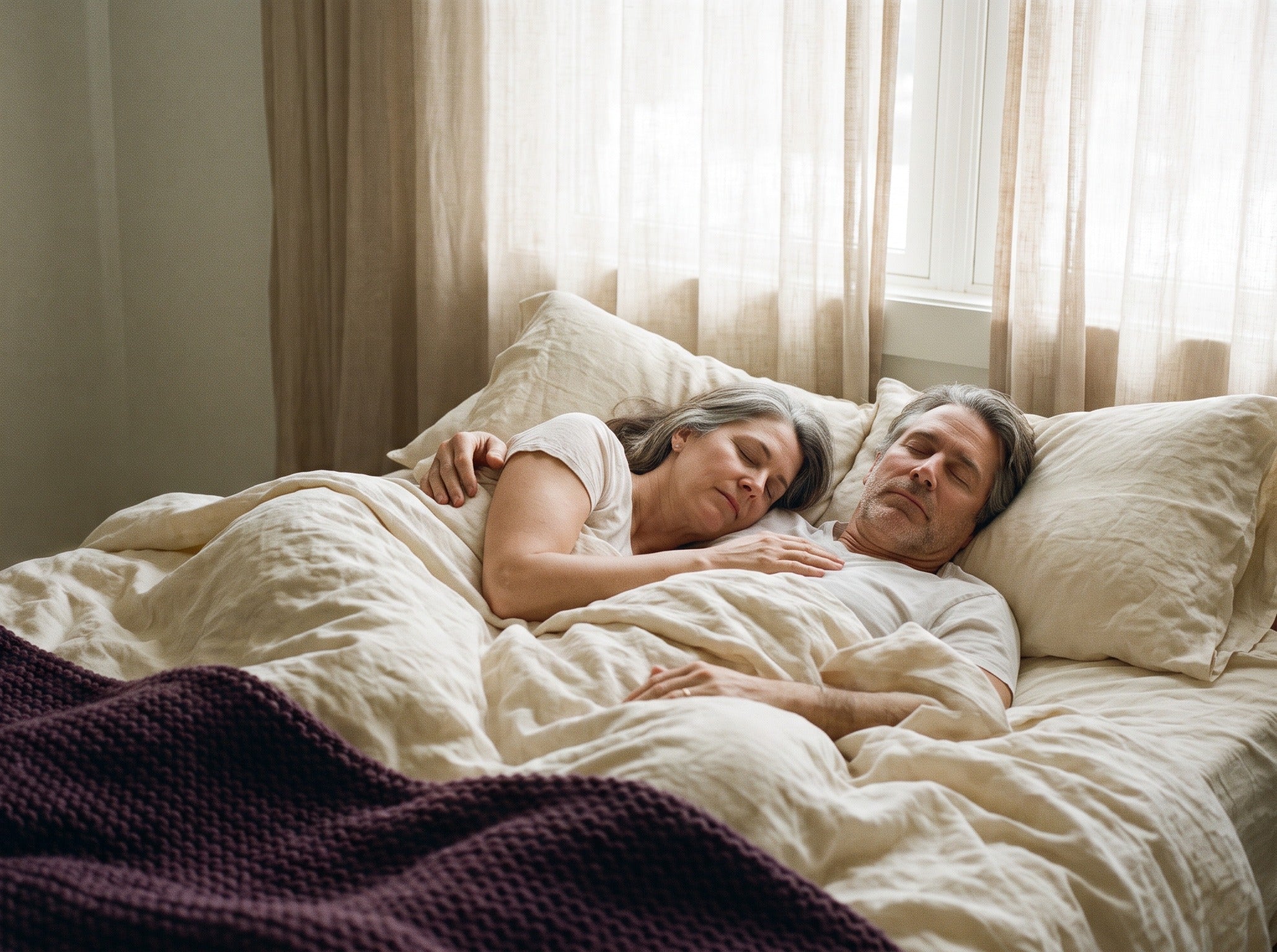 Couple asleep together at dawn
